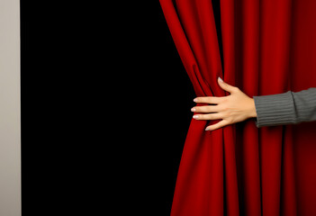 banner or header of Female hands pulling aside the red curtain on black background