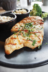 grill chicken meat served with salad on a plate 