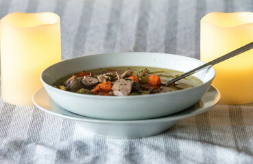 Hearty and nutritious food, chicken soup with vegetables. Real low carb food