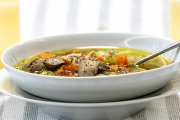 Hearty and nutritious food, chicken soup with vegetables. Real low carb food
