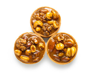Tasty tarts with nuts and caramel isolated on white background