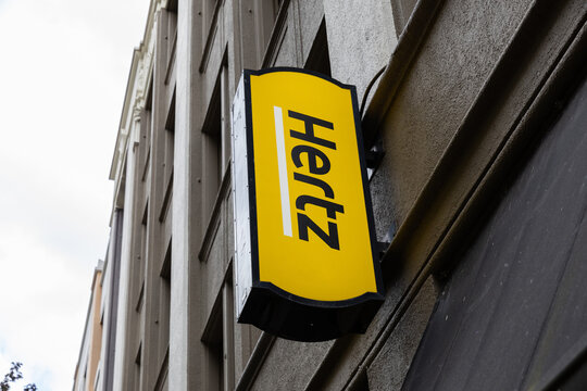 Portland, OR, USA - Aug 12, 2024- yellow vertical Hertz car rental company signage in Downtown Portland, Oregon