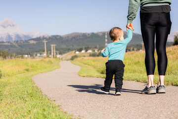 Fototapeta premium Parent and Child Walking Together in Crowsnest Pass, Alberta