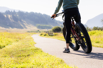 Cyclist Riding On Scenic Path In Crowsnest Pass, Alberta