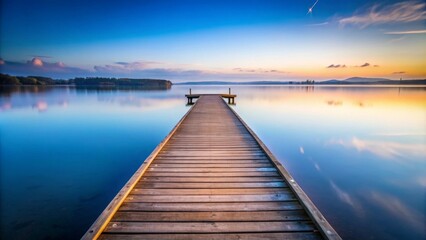 Naklejka premium Tranquil scene of a pier stretching out into a serene lake
