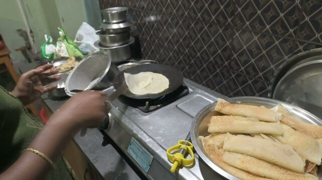 Home made preparation of Patishapta Pitha, a famous Bengali Dessert Recipe, during Winter season. Patishapta is a type of pithe made in celebratory occasions, quick Indian dessert. West Bengal, India