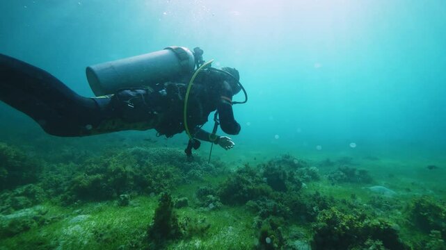 Team of equipped drivers explores hilly ocean floor 
