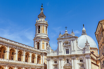 Stunning architecture of the Basilica of the Holy House in Loreto under a bright blue sky. Loreto, Marche, Italy
