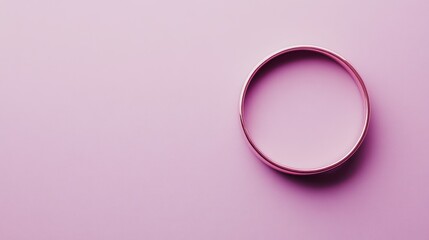 Obraz premium Golden Ring on a Pink Background