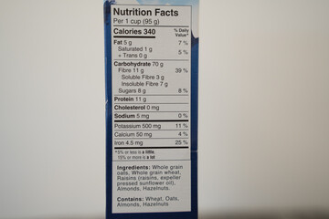 Nutrition labels on cereal boxes in a pantry