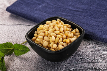 Peeled cedar nut in the bowl