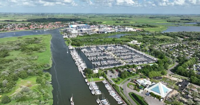 Canal Makkumer Djip leading into Makkum, Friesland, typical dutch village between the Afsluitdijk and Workum on the coast of the IJsselmeer