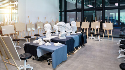 School art room with easels and sculptures