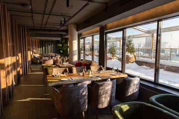 Interior of modern cozy restaurant with soft sofas