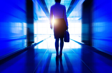 Businesswoman walking in the office corridor