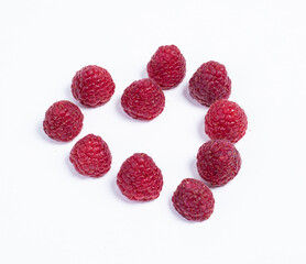 heart shape made from red raspberries isolated on white background, valentine's day concept, heartbeat, healthy heart