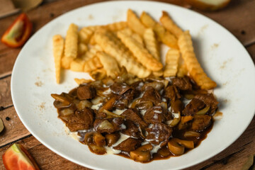 Beef Stew with Creamy Sauce and French Fries