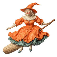 Obraz premium A whimsical witch figurine in an orange dress, joyfully flying on a broomstick, perfect for Halloween decor.