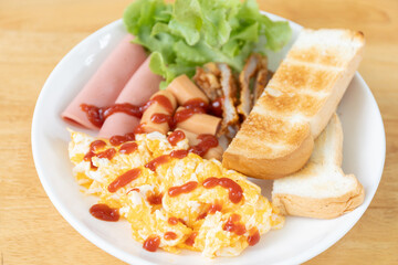 Gourmet Breakfast Dish: Scrambled Egg, Sausage, Ham, Bread, and Lettuce with Ketchup, A High-Energy Meal to Start Your Day