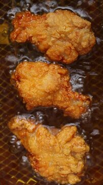 Top view of Deep fry chicken drumstick in deep-fryer. 
