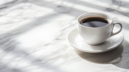 A cup of black coffee on a marble table