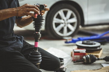 Car front drive shaft rebuild and repair in garage services.