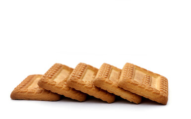 Indian biscuits stacked over white background