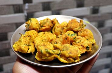 Popular street food item mix bhajiya snacks or Pakoda or Pakora