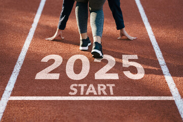 New year resolution 2025 concept. Word start 2025 written on athletics track and athlete woman runner preparing for new year for challenge and change. planning health and the goal to success