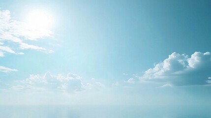 Obraz premium Serene Blue Sky: A tranquil expanse of azure sky, bathed in the soft glow of the sun, with wispy white clouds drifting gracefully across the horizon. 