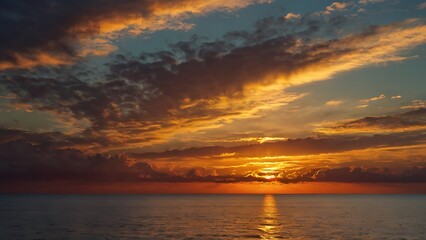 Fototapeta premium Seaside shores evening view with sun on a beautiful orange sunset, oceanic view under clear sky full of different shaped clouds