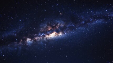 Fototapeta premium A stunning view of a galaxy filled with stars and cosmic dust in a dark night sky.