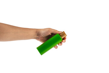 Green shampoo bottle in hand isolated on transparent background