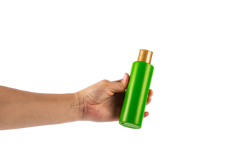 Green shampoo bottle in hand isolated on transparent background