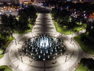 Stunning modern illuminated circle fountain in Kharkiv city Freedom Square aerial © Kathrine Andi