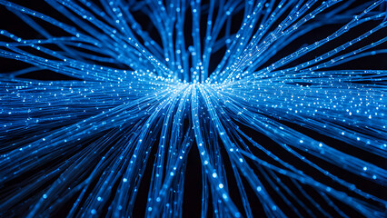 Detailed close-up of fiber optic cables glowing with vibrant blue light, showing the fine strands and delicate connections.