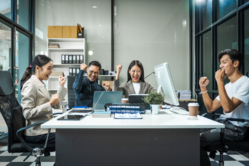 Asian colleagues meet at a desk, discussing business financial terms, investment strategies,...