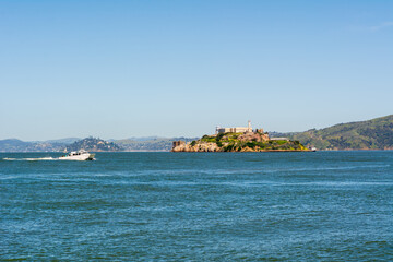 Tourist boat against Alcatraz prison Island in San Francisco, California, USA