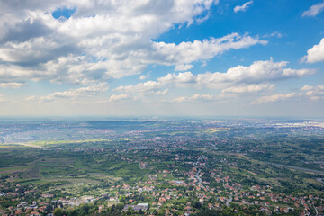 A city view with a blue sky and clouds