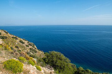 The green valley in spring and the sea view behind it. Green forest land and seascape in the background. Wonderful valleys and bays overlooking the sea. Muğla, T&uuml;rkiye.