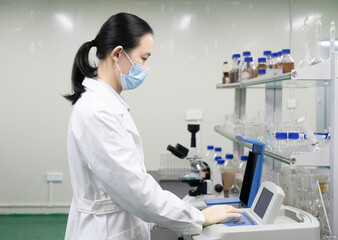 Researchers operate experimental equipment in the laboratory
