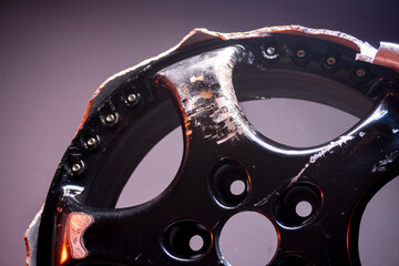 car wheels titanium rims black after a traffic accident in a dark room