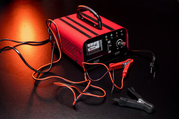 red new car battery charger with ammeter and terminals for 6 volts and 12 volts