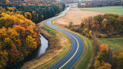 Fototapeta premium A stunning highway landscape at sunset, capturing the endless road stretching into the horizon, surrounded by rolling hills and vibrant skies.