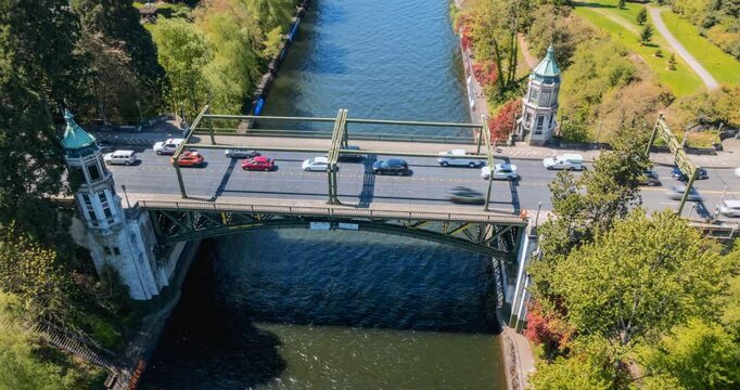 Aerial Hyperlapse of Historic City Bridge with Cars and Boats