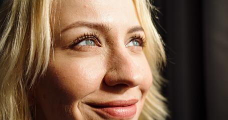 Close up portrait of young Caucasian female with beautiful eyes and smile on face. Pretty woman...