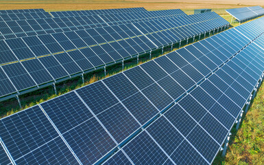 Field of solar panels generating sustainable energy under sun