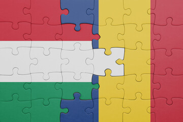 puzzle with the colourful national flag of romania and flag of hungary.