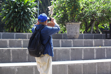 Senior Tourist Man Take A Video Using Smartphone On The Park Outdoor