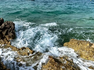 waves crashing on rocks